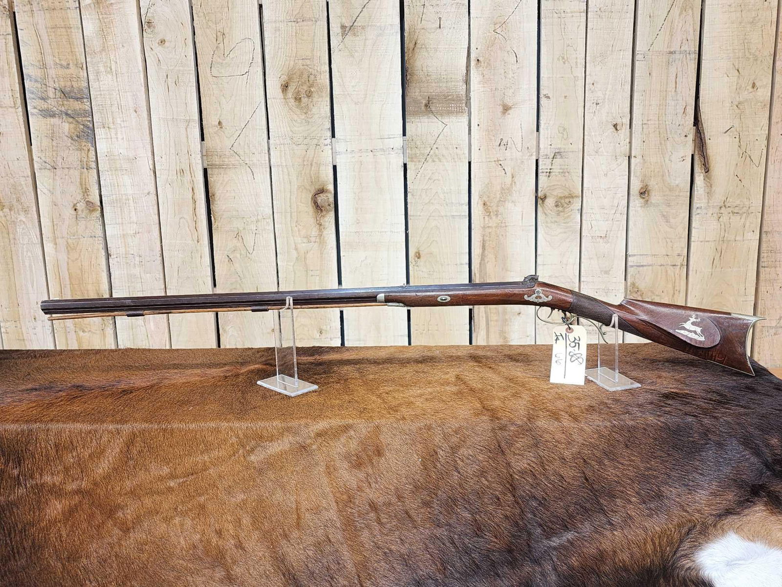 Vintage 36cal Black Powder Rifle: 35.88 Good patina silver inlays Monte Carlo style stock 35" Octagon barrel double set trigger appears to be a quality crafted gun maker unknown
