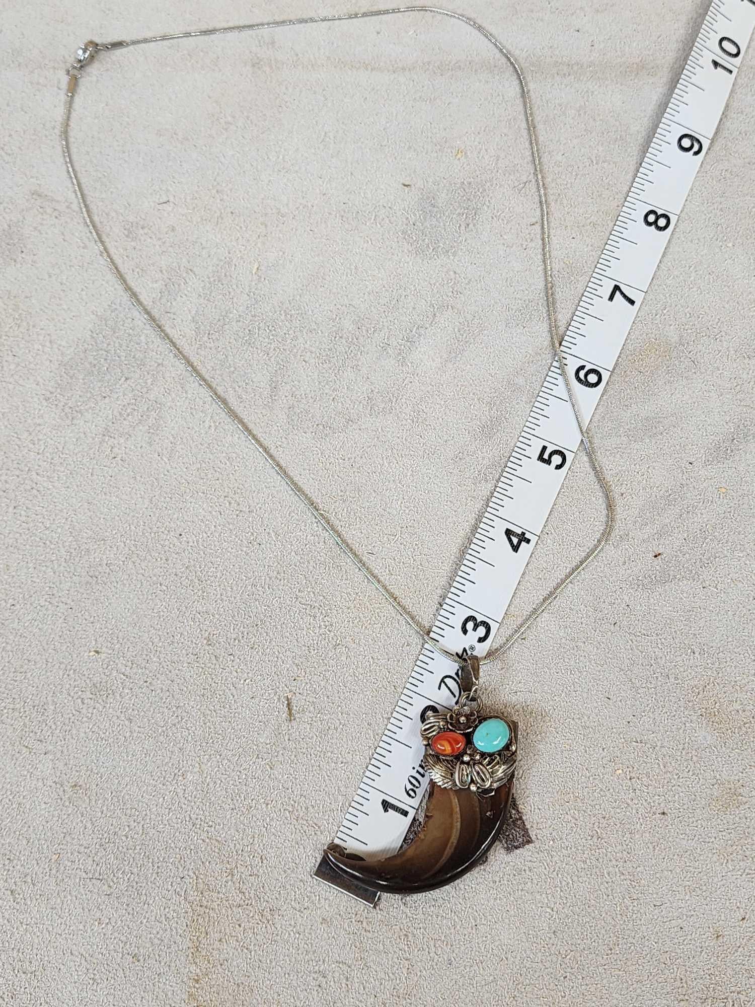 Native American Style Black Bear Claw Necklace: 48.4 Silver with detailed tooling decorated with red coral turquoise stones polished to a high sheen great look on Silver chain