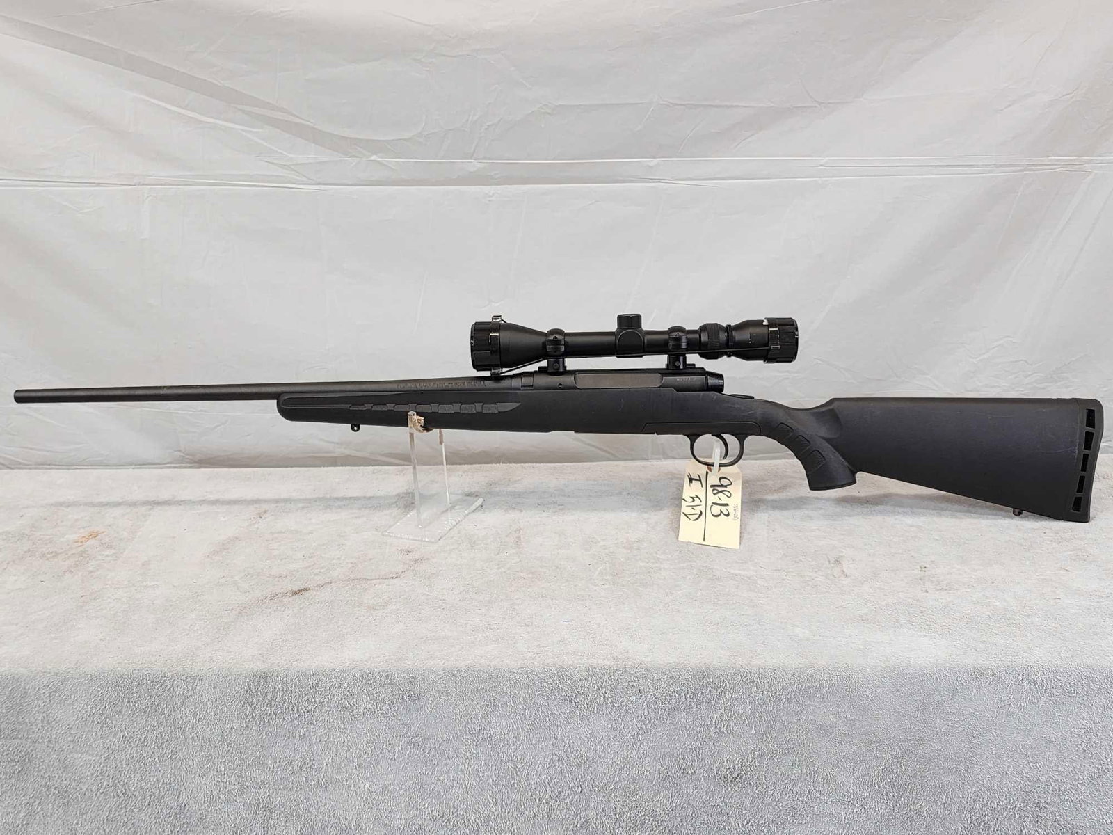 Savage Axis. 243 Bolt Action Rifle: 98.13 Nice clean gun with bushnell scope 22" barrel shiny bore good rifling SN H437952