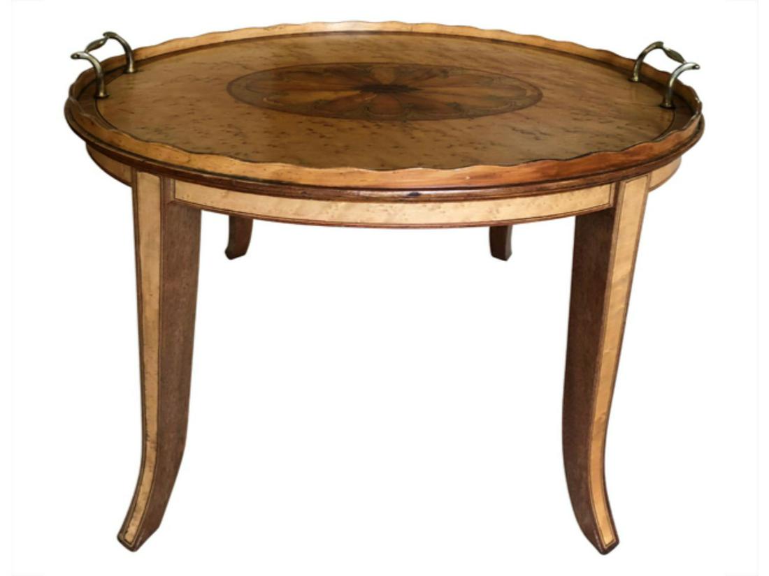 Oval Tray Table with Floral Medallion Inlay: A traditional addition to any living room, this wood table features finishes of brown with a medallion design on top. Though in good condition, some wear and tear just lends extra rustic charm. The ci