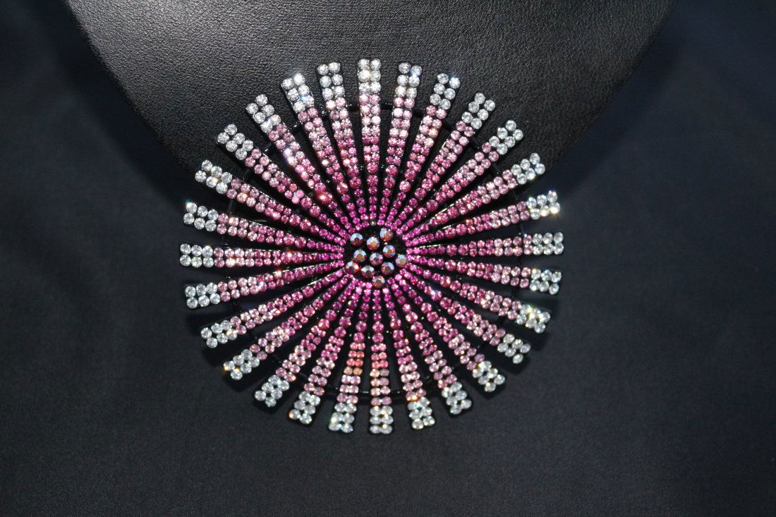 Multi Stoned Large Brooch: This large brooch is named but unfortunately i cannot work out the name on the tab.This is a multi coloured stone circular piece. The stones i believe are glass.This really is a statement piece.There