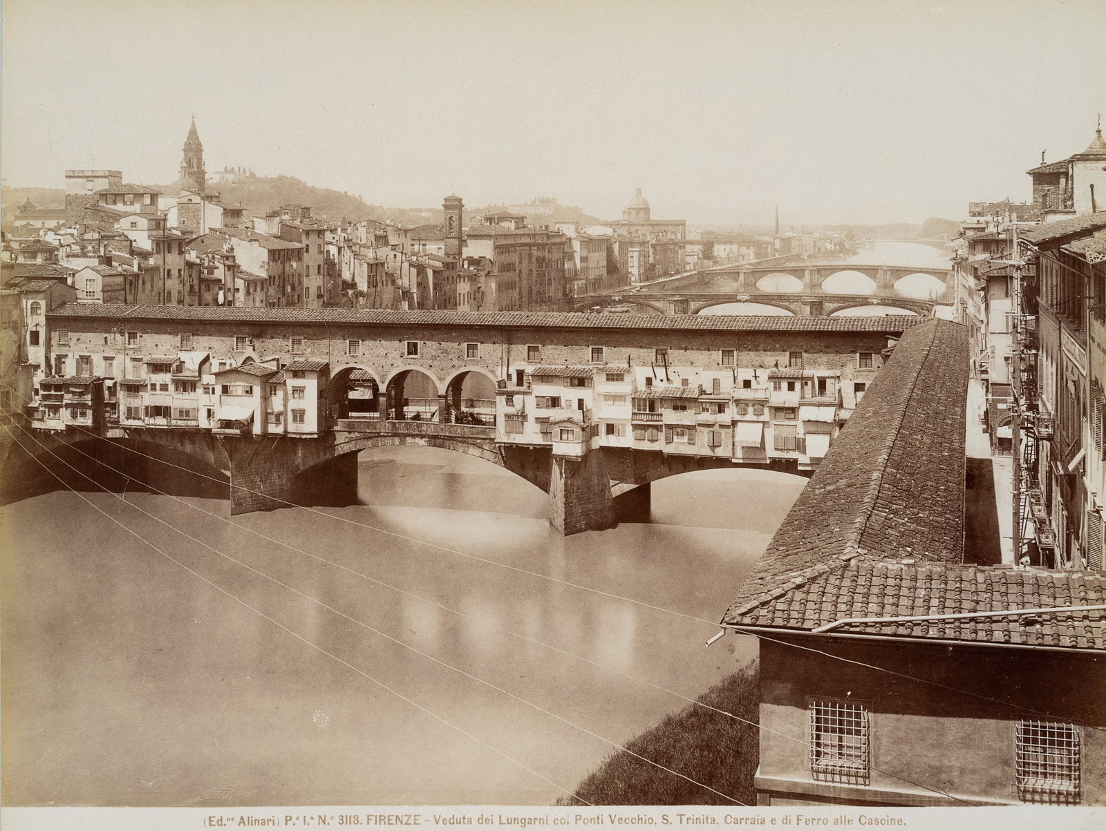 FRATELLI ALINARI (19th), Ponte Vecchio over the Arno, Florence, around 1890, albumen paper print: Fratelli Alinari (19th century): View of the city from the banks of the Arno over the Ponti Vecchio bridge, with Santa Trinita in the background, Florence, c. 1890, albumen paper print Technique: albu