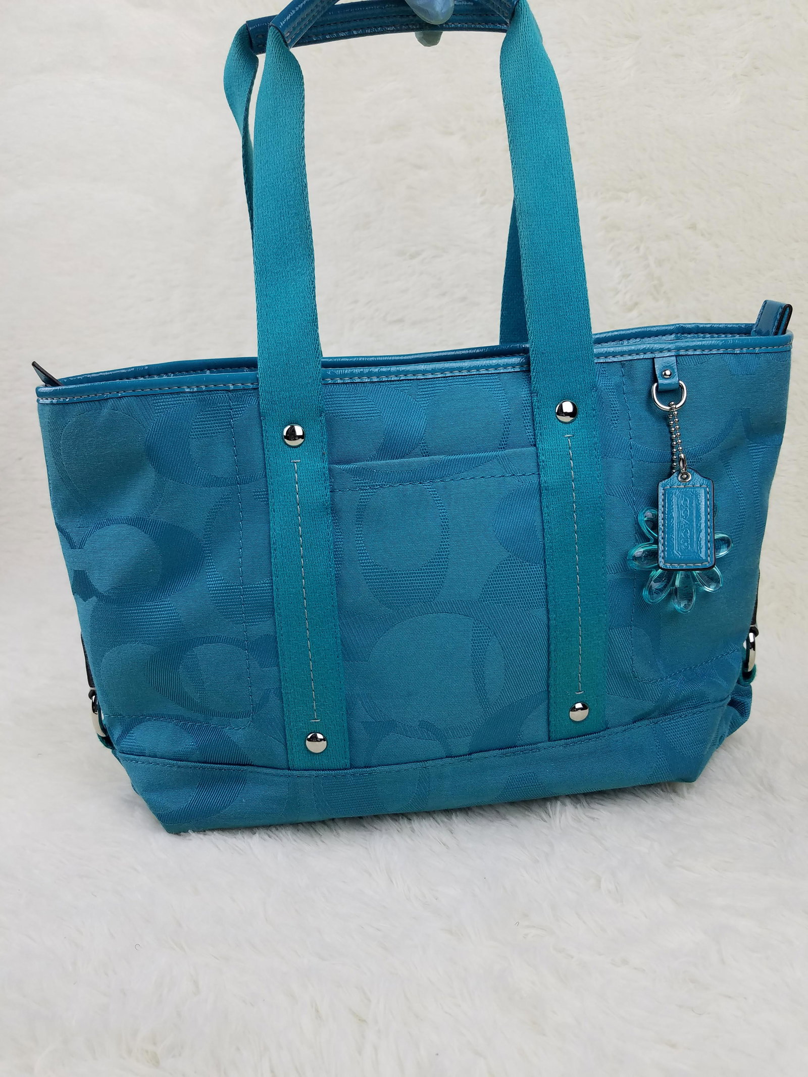 Coach Tortquiose Satchel Purse: Brand: Coach Material: Canvas Style: Satchel Color: Tortquiose Size(inch): 15.5 x 10 x 7 Country of Origin: Come with: - Rabbit's Habit items come with a 100% money-back authenticity guarantee. Please