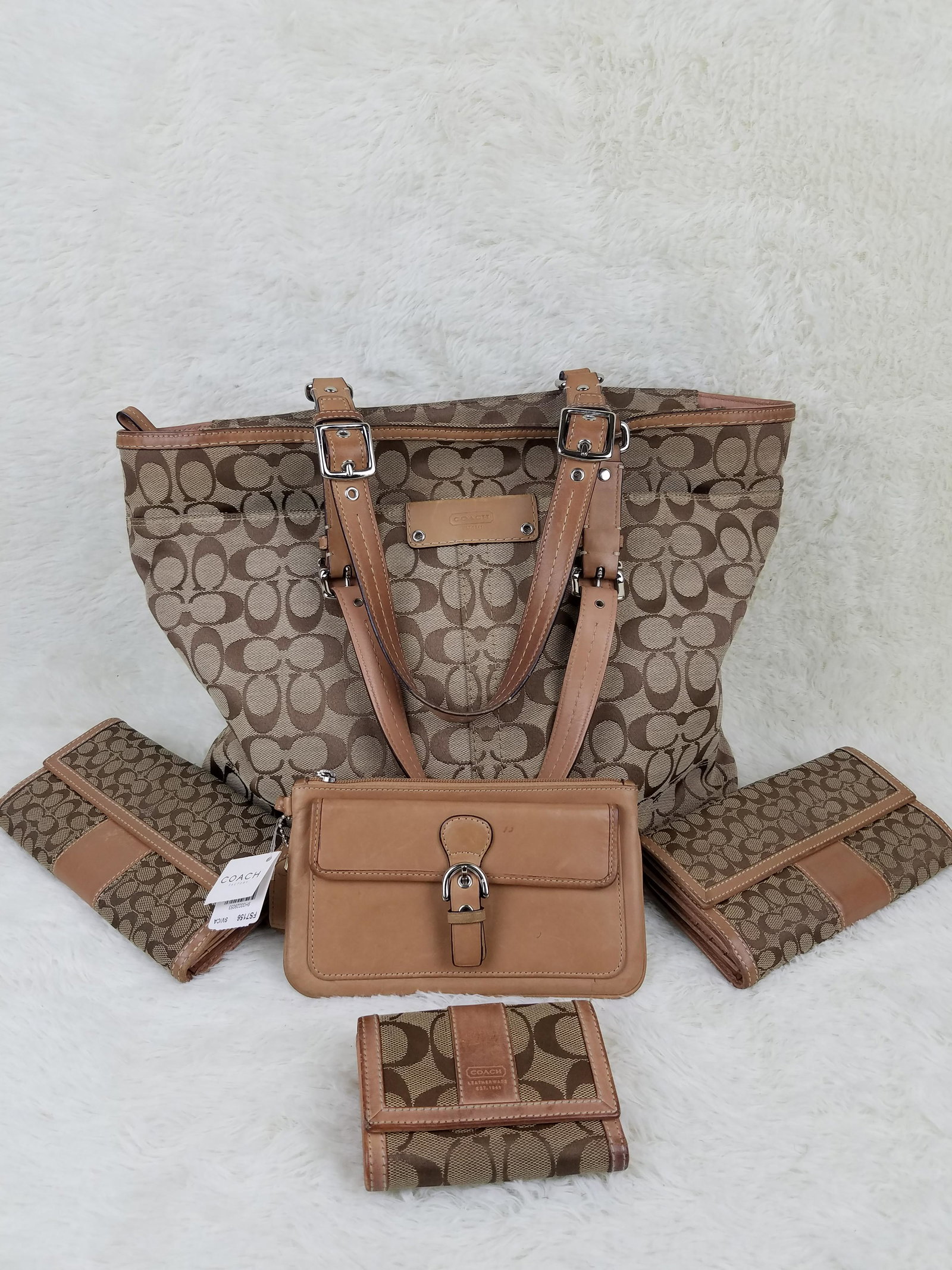 Lot of 5 Coach Set: 1 Coach Purse and 4 Brown Wallets: Brand: Coach Material: Purse: Canvas, Wallets: LEFT: Canvas, RIGHT: Canvas, MIDDLE(NWT): Leather, Bottom: Canvas Style: Color: Brown Size(inch): Purse: 17 x 12 x 9.25, Wallets: LEFT: 7.5 x 4, RIGHT: 7