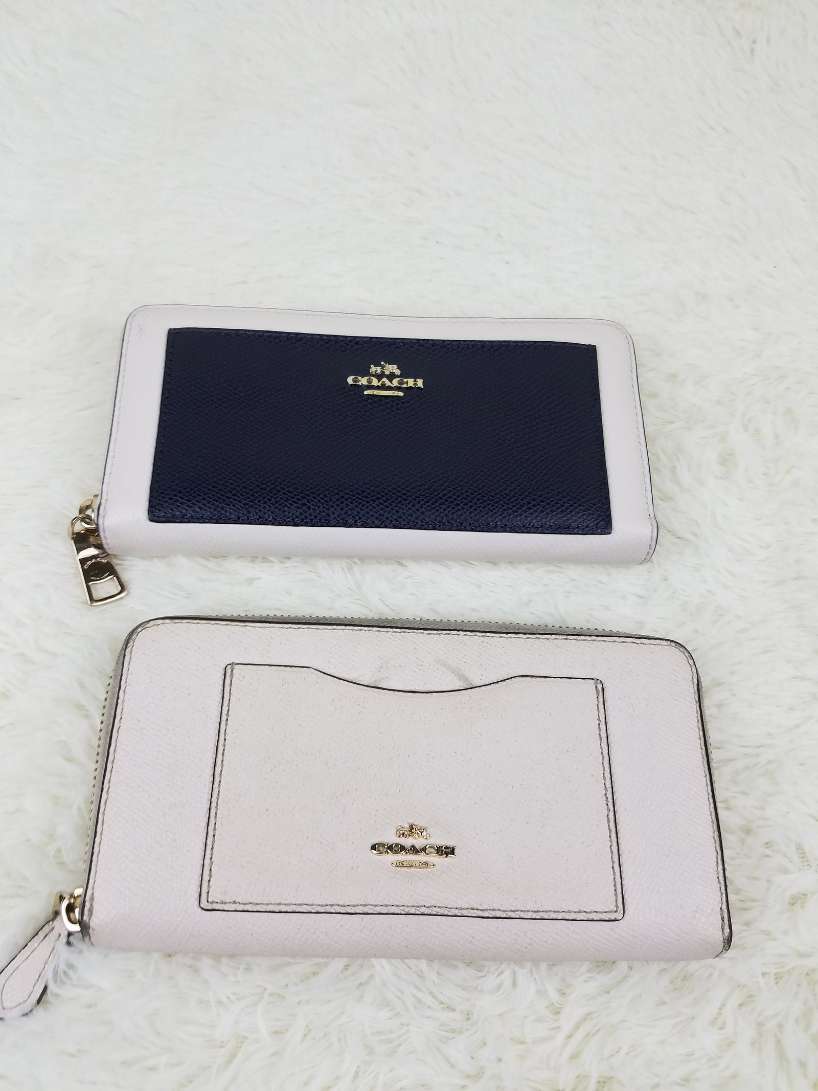 Coach Lot of 2: 1 Coach and 1 Coach Wallet: Brand: Coach Material: Leather Style: Color: Top: White and Black and Bottom: Off White Size(inch): Top: 8 x 4. Bottom: 8 x 4 Country of Origin: Come with: - Rabbit's Habit items come with a 100% mone
