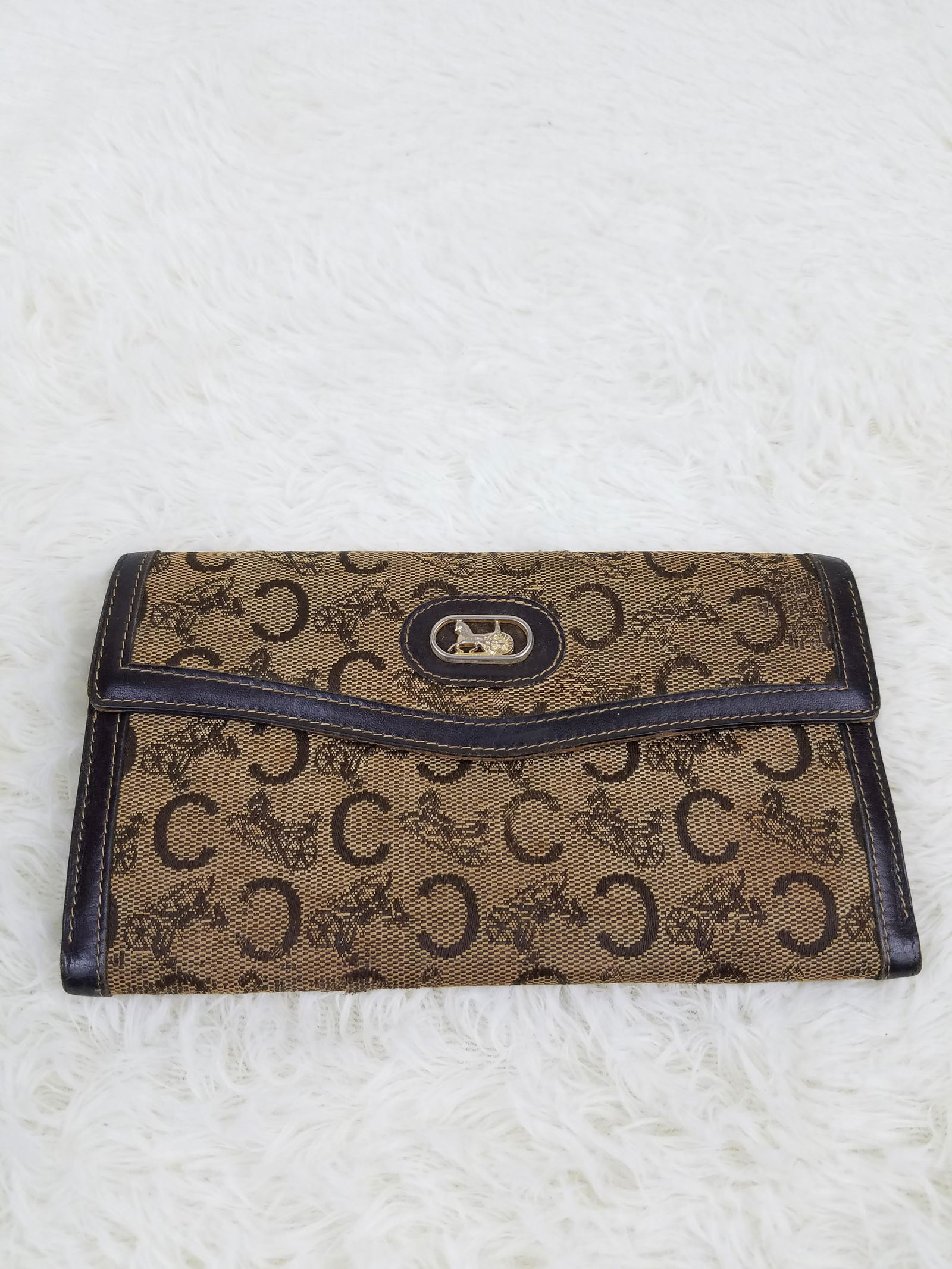 Celine Monogram Wallet: Brand: Celine Material: Canvas Style: Clutch Color: Brown Size(inch): 7.25 x 4.5 Country of Origin: Italy Come with: - Rabbit's Habit items come with a 100% money-back authenticity guarantee. Please r