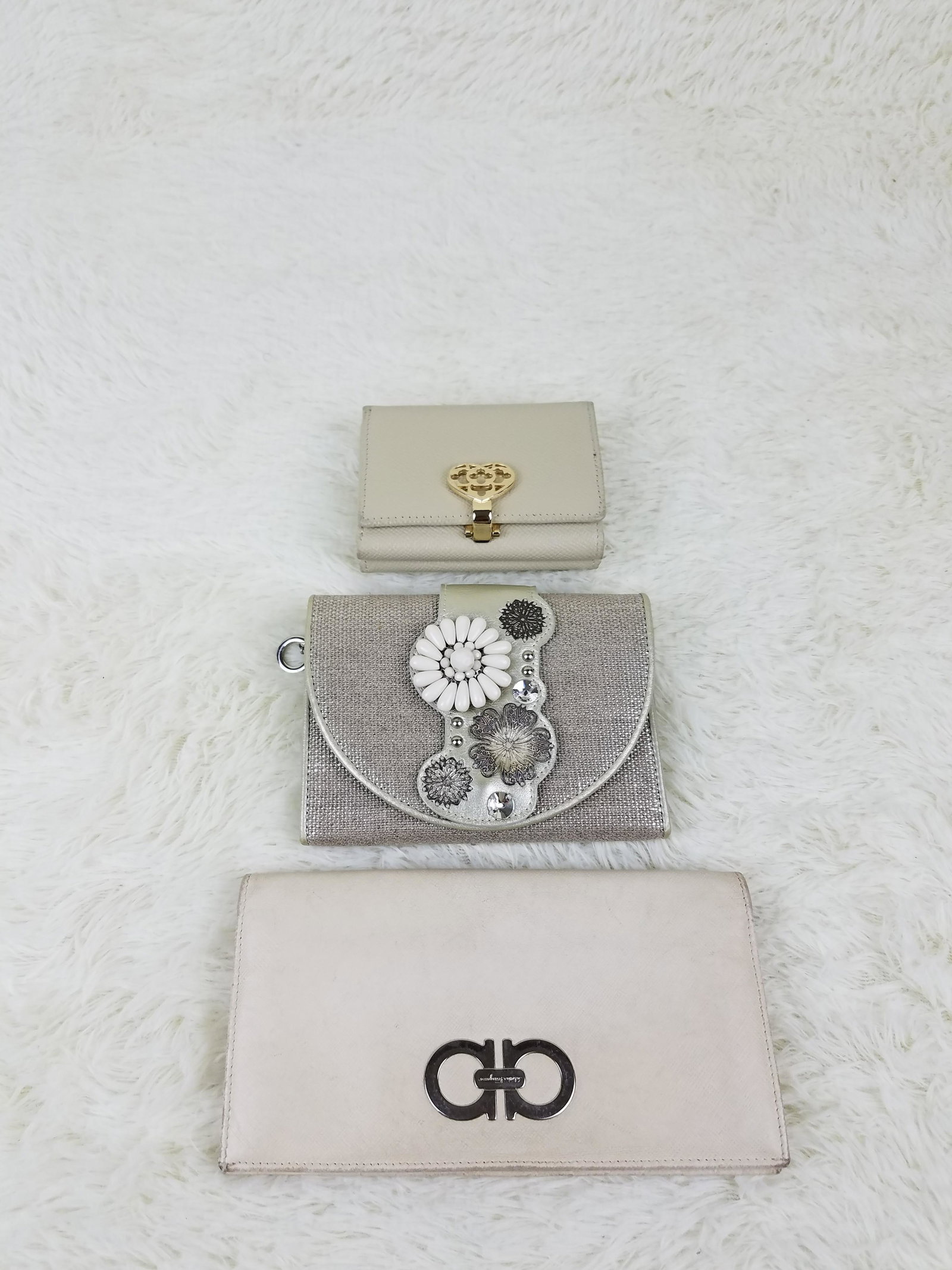3 High End Designer Wallets Salvatore Ferragamo: Brand: Salvatore Ferragamo, Anteprima Material: Various Style: Lot Color: White, Silver Size(inch): Country of Origin: Italy, others Come with: - Rabbit's Habit items come with a 100% money-back authe