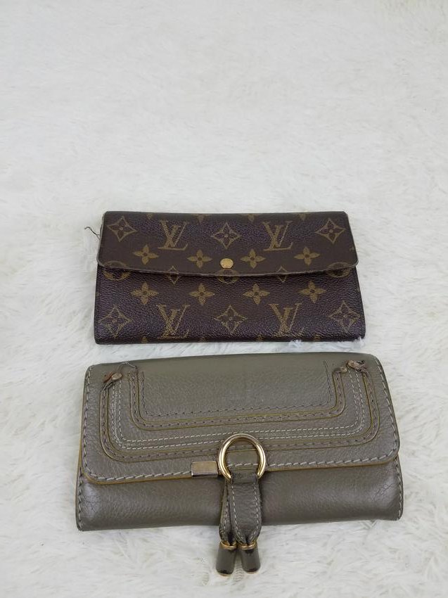 Set Of 2 Designer Wallets Chloe Louis Vuitton Monogram: Brand: Gucci, Chloe Material: Leather Style: Monogram, Lot Color: Brown, Grey Size(inch): Lot Country of Origin: France, Romania Come with: - Rabbit's Habit items come with a 100% money-back authentic