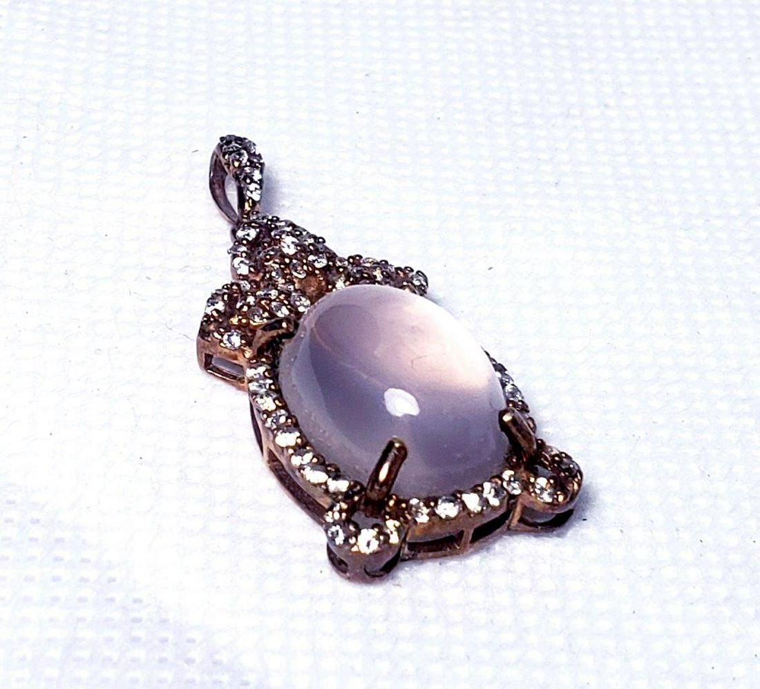Gold Coated Moon Stone Healing Pendant: Gold Coated Moon Stone Healing Pendant - XX mm: Flat-rate of $23.00 to anywhere.shipping rates are determined by Parcel weight and destination.