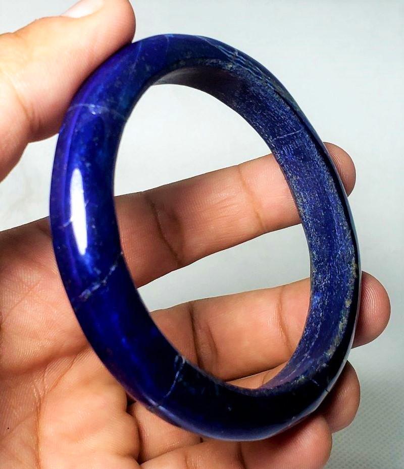 Royal Blue Lapis Lazuli Healing Bangle: Royal Blue Lapis Lazuli Healing Bangle Shipping: $23.00. Shipping rates are determined by Parcel weight and destination.