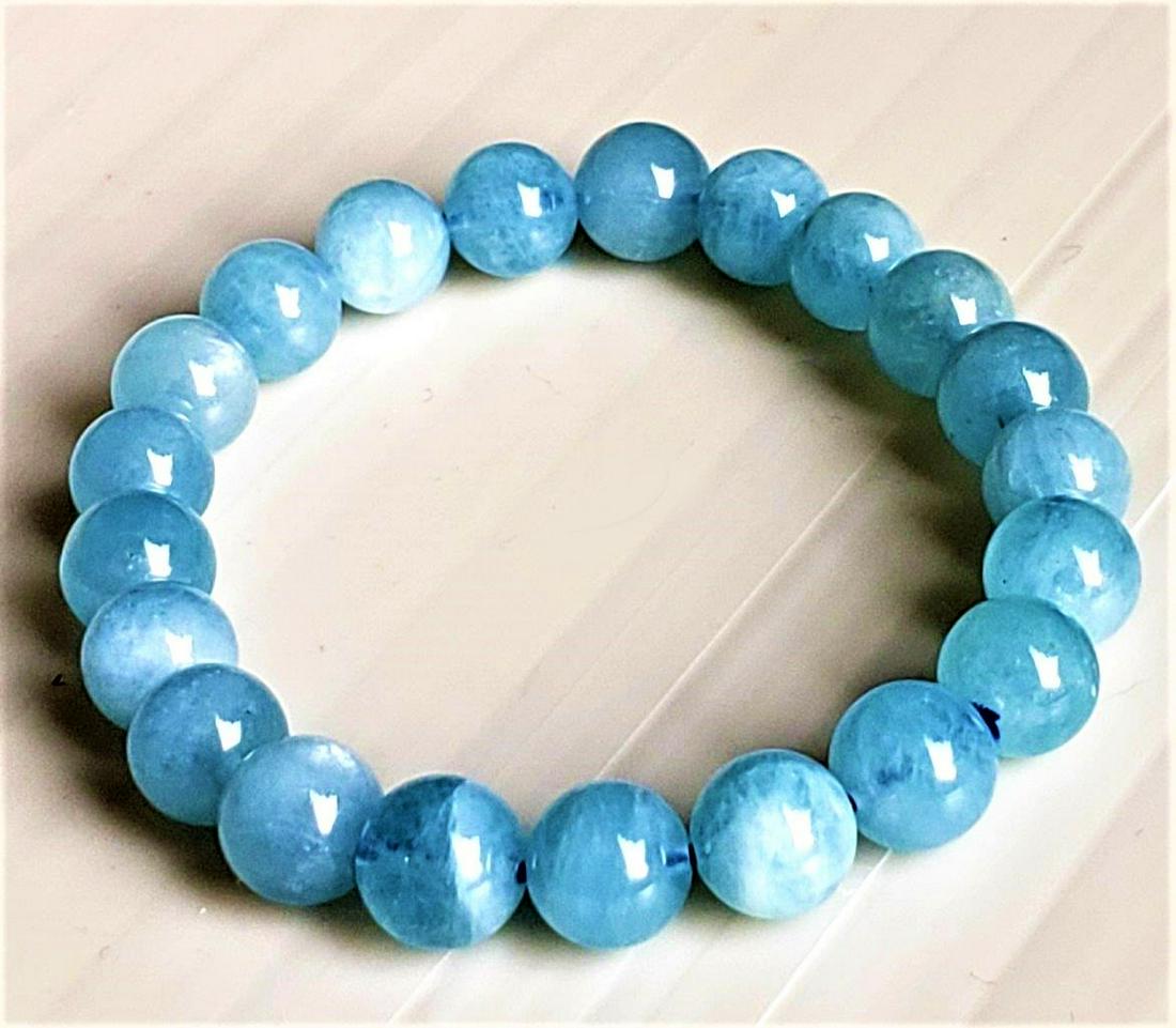 Aquamarine Beaded Calming Bracelet - 9 mm: Aquamarine Beaded Calming Bracelet - 9 mm Shipping: $23.00. Shipping rates are determined by Parcel weight and destination.