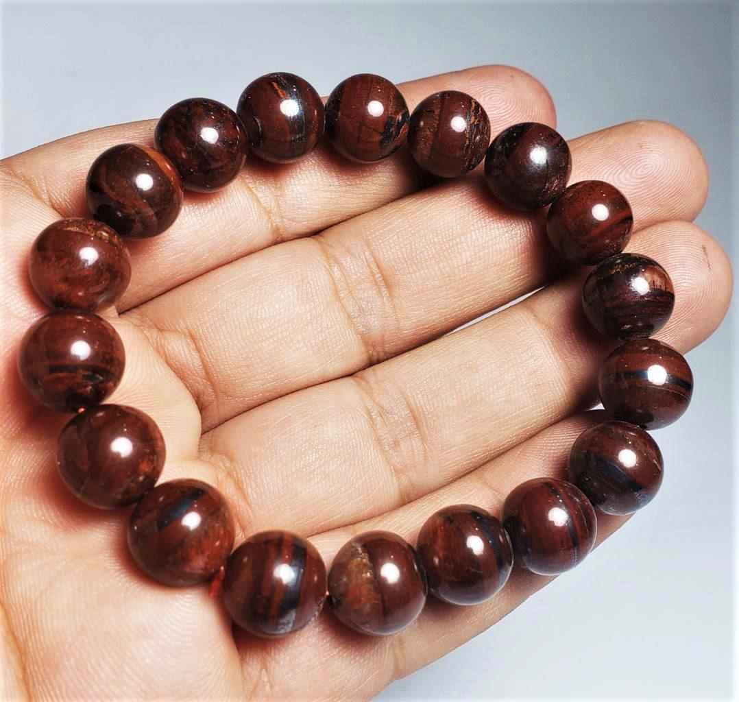 Natural Tiger Eye Bracelet Round Calibrated Beads: Natural Tiger Eye Bracelet Round Calibrated Beads Shipping: $23.00. Shipping rates are determined by Parcel weight and destination.