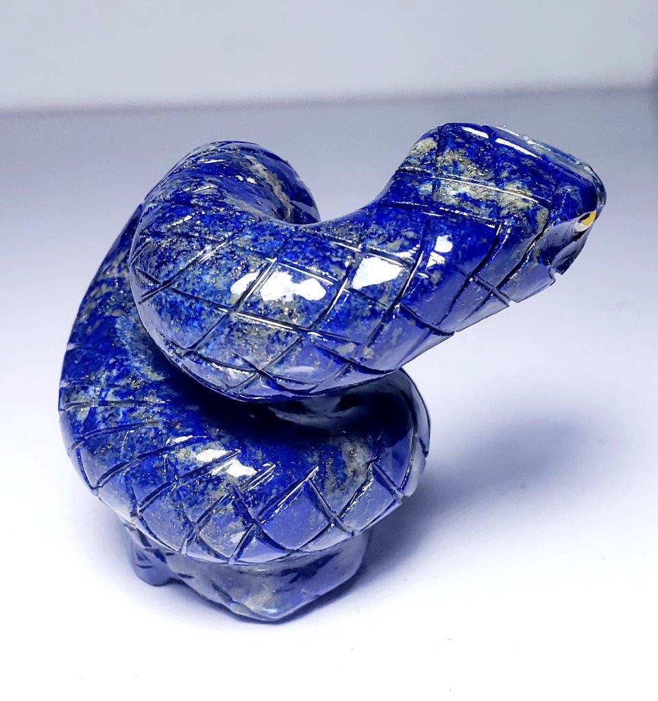 Lapis Lazuli Snake - 189.6 Grams: Lapis Lazuli Snake - 189.6 Grams - 64X64X46 mmShipping Rate: $23.00 .shipping rates are determined by Parcel weight and destination.Combined shipping: We offer combine shipping on multiple items purch