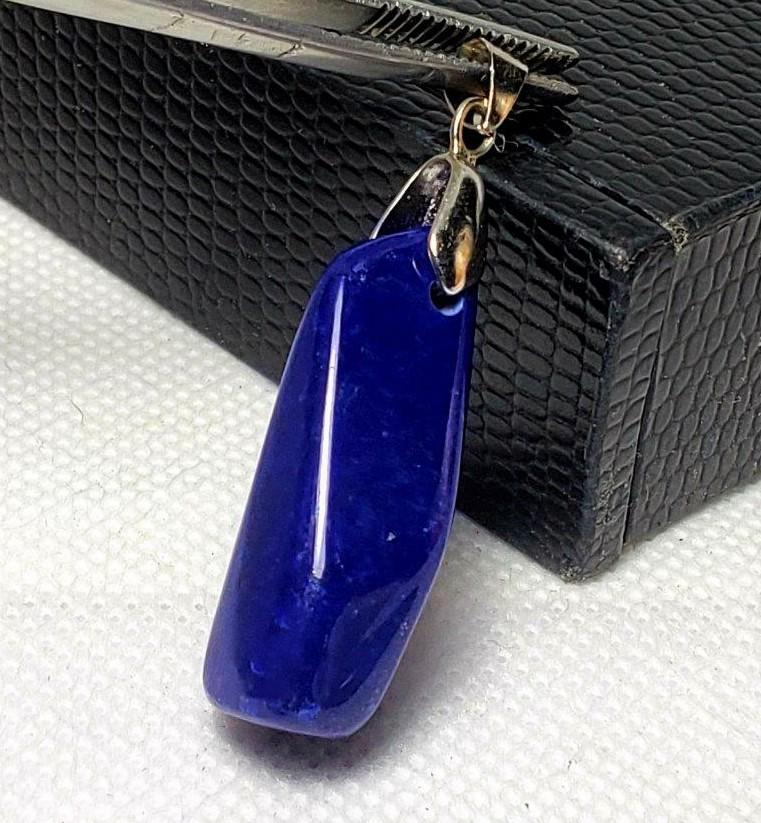 Silver Lapis Lazuli Pendant: Silver Lapis Lazuli Pendant - 34X10X10 mm Shipping: $23.00. Shipping rates are determined by Parcel weight and destination.