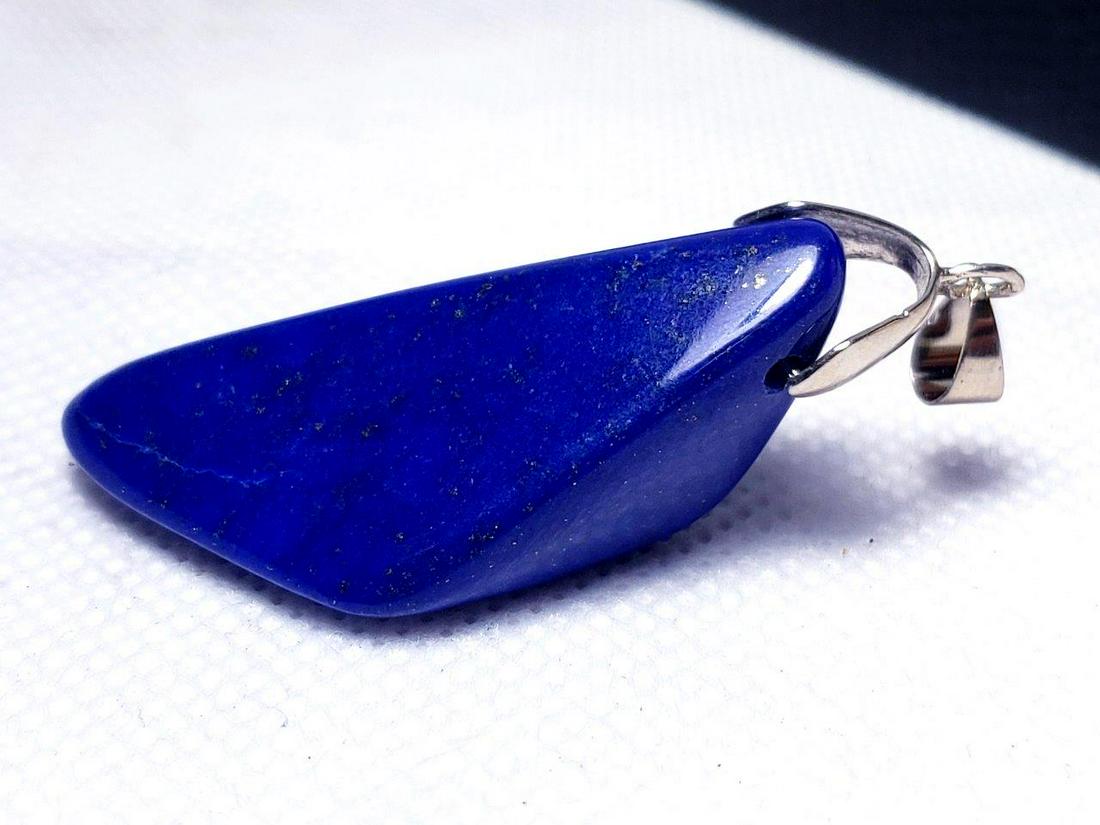 Sterling Silver Lapis Lazuli Pendant: Sterling Silver Lapis Lazuli Pendant - Chakra Jewelry- 40X20X13mm Shipping: $23.00. Shipping rates are determined by Parcel weight and destination.