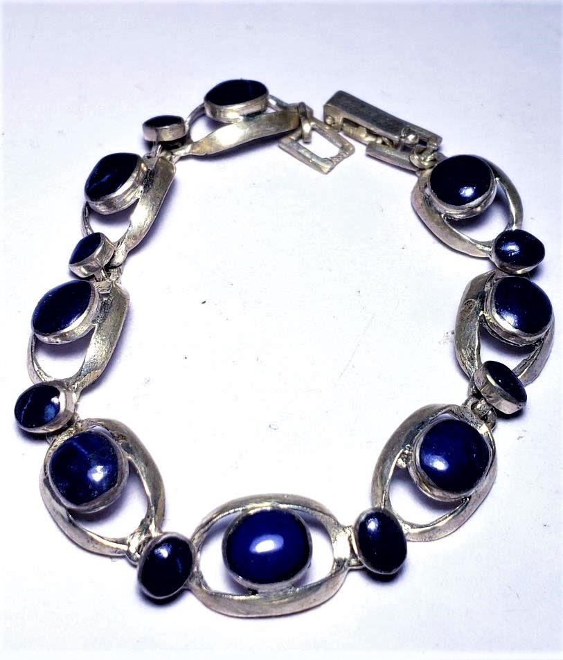 Sterling Silver Lapis Lazuli Bracelet: Sterling Silver Lapis Lazuli Bracelet Shipping: $23.00. Shipping rates are determined by Parcel weight and destination.