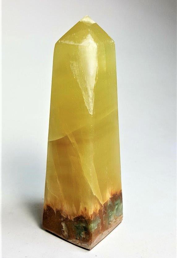 Lemon Calcite Point - 416.19 Grams: Lemon Calcite Point - 416.19 Grams - 138X43X41 mm Shipping: $45.00. Shipping rates are determined by Parcel weight and destination.