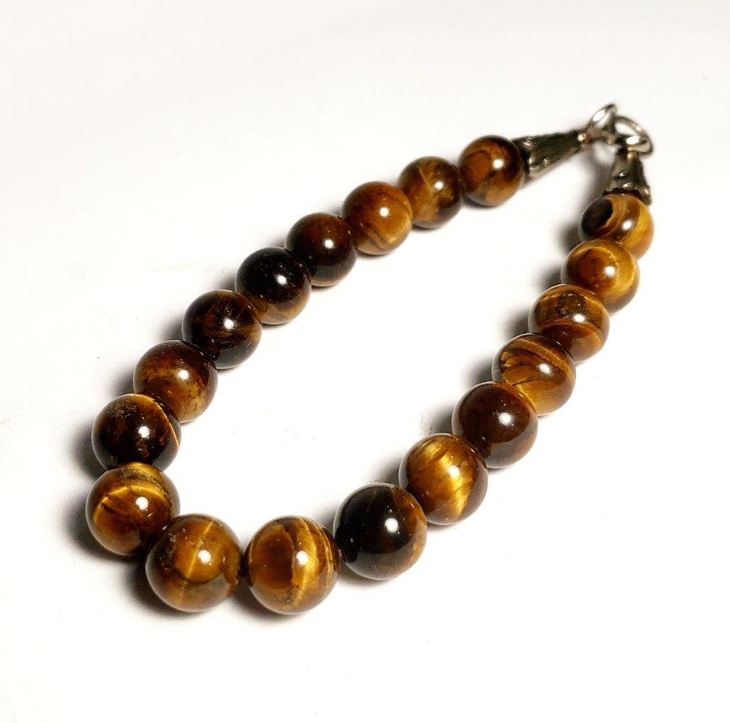 Charm Tiger Eye Silver Bracelet: Charm Tiger Eye Silver Bracelet Shipping: $23.00. Shipping rates are determined by Parcel weight and destination.