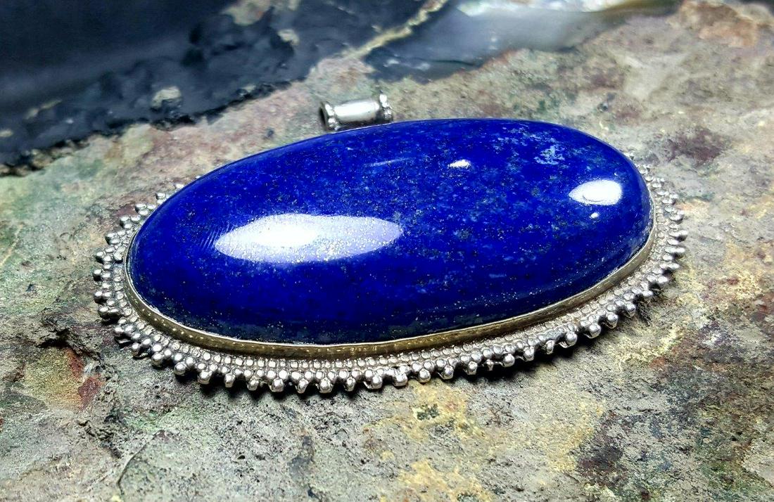 Natural Lapis Lazuli Stone pendant: Elegant Natural Lapis Lazuli Stone pendant - 65X38X12 mmShipping Rate: $23.00 .shipping rates are determined by Parcel weight and destination.Combined shipping: We offer combine shipping on multiple i