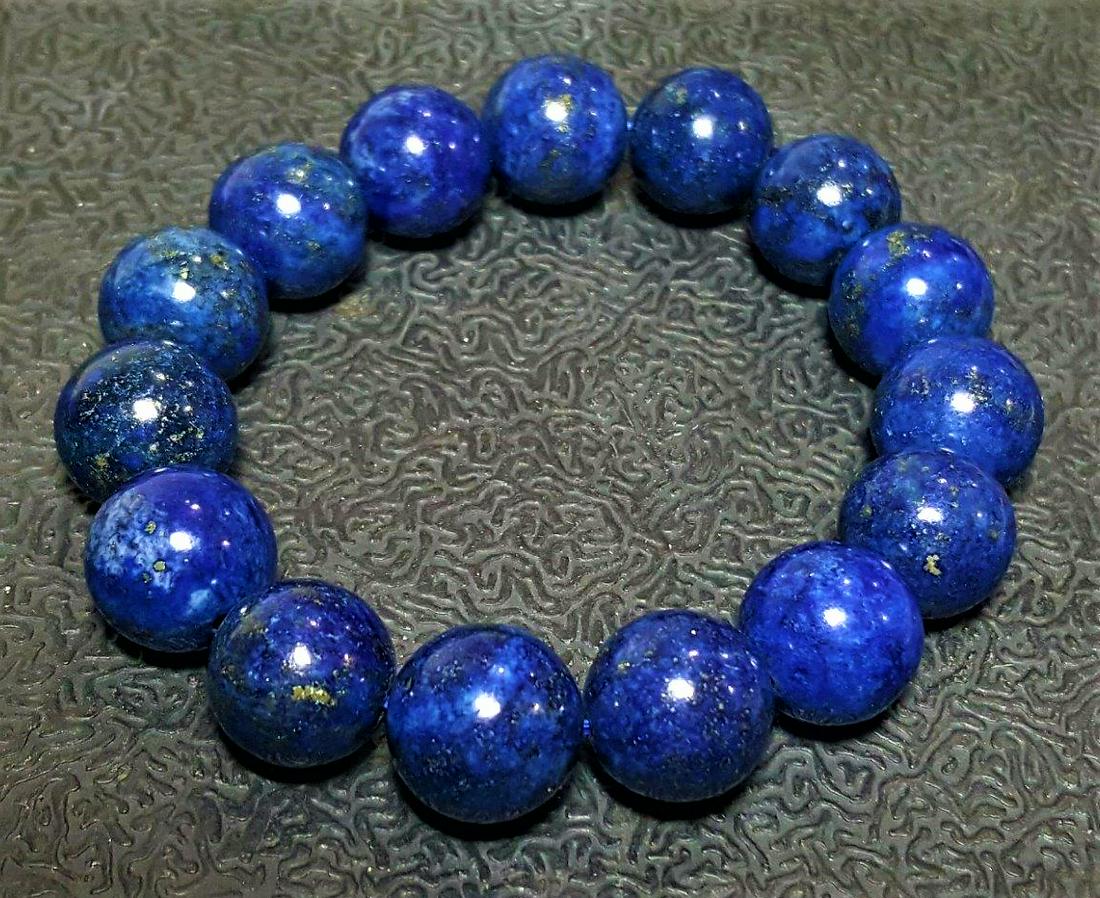 Lapis Lazuli Bracelet - 14 mm Beads Size: Lapis Lazuli Bracelet - 14 mm Beads Size Shipping: $23.00. Shipping rates are determined by Parcel weight and destination.