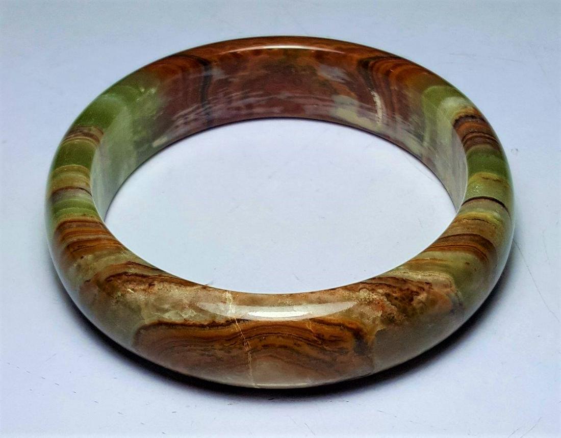 Brownish Green Onyx Multi-Colored Bangle: Brownish Green Onyx Multi-Colored Bangle Shipping: $23.00. Shipping rates are determined by Parcel weight and destination.