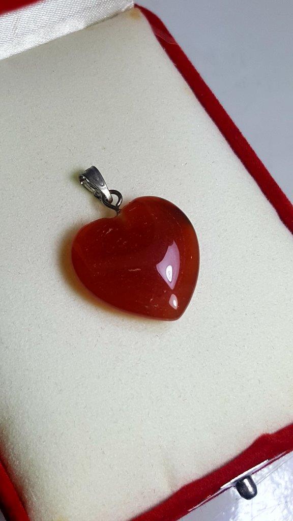 Agate Heart Pendant: Agate Heart Pendant - 25X21X6 mm Shipping: $23.00. Shipping rates are determined by Parcel weight and destination.