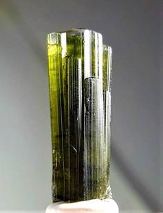 Green Tourmaline Crystal - 4.1 Grams: Green Tourmaline Crystal - 4.1 Grams - 25X11X9 mmShipping Rate: $23.00 .shipping rates are determined by Parcel weight and destination.Combined shipping: We offer combine shipping on multiple items