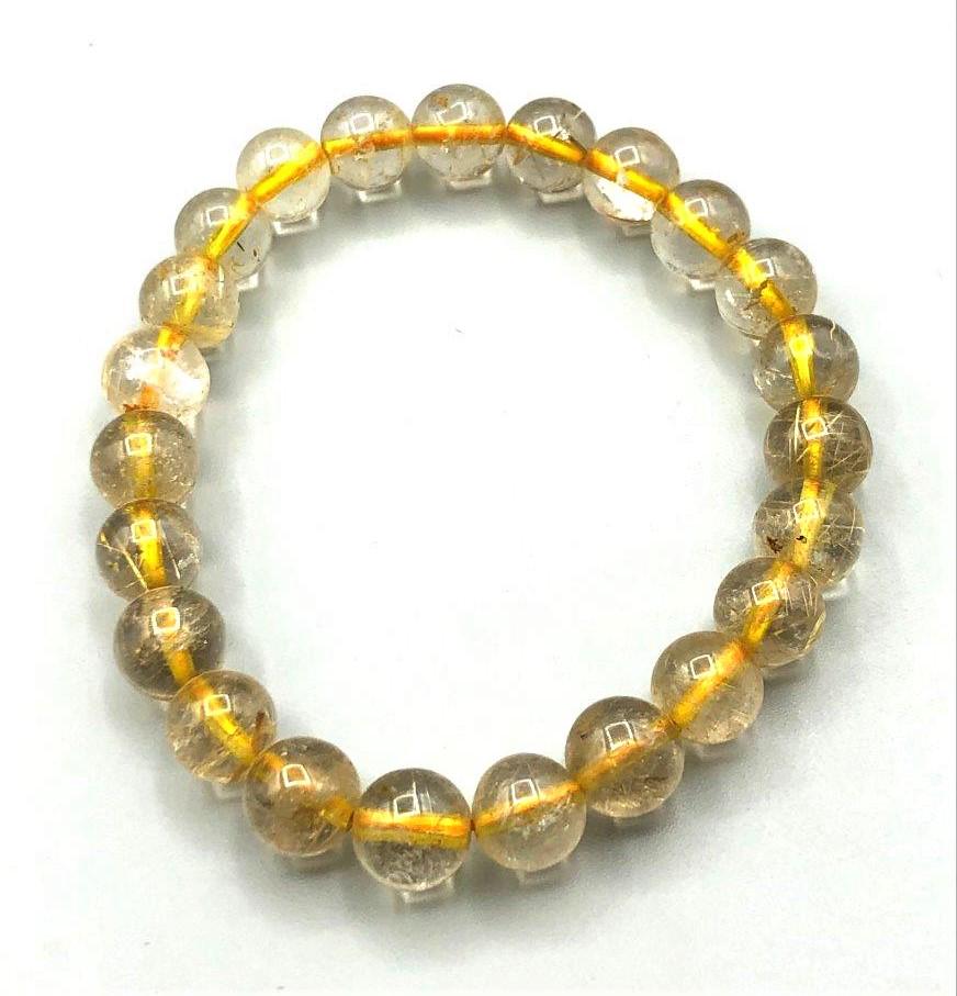 Rutiled Quartz Charm Bracelet: Rutiled Quartz Charm BraceletShipping Rate: $23.00 .shipping rates are determined by Parcel weight and destination.Combined shipping: We offer combine shipping on multiple items purchased to reduce sh