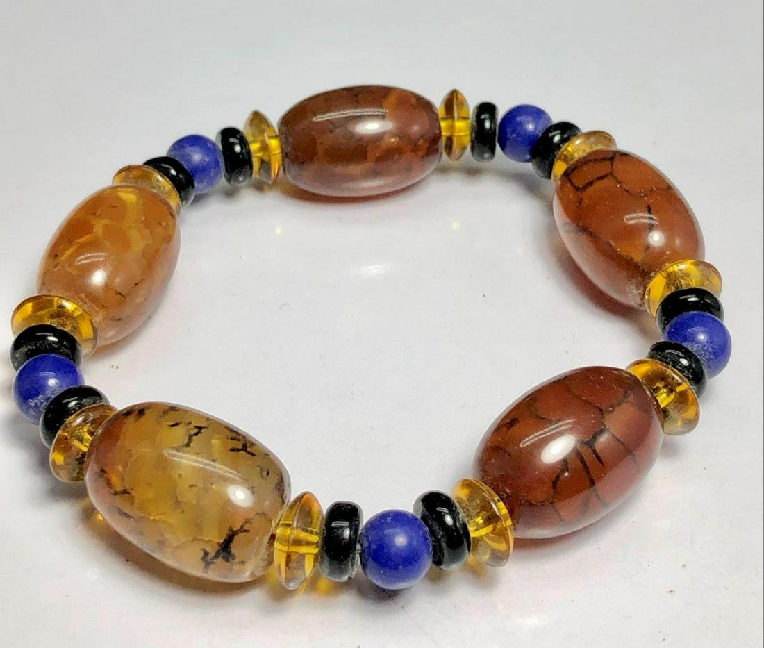 Prosperity bracelet with agate beads: Prosperity bracelet with agate beadsShipping Rate: $23.00 .shipping rates are determined by Parcel weight and destination.Combined shipping: We offer combine shipping on multiple items purchased to re