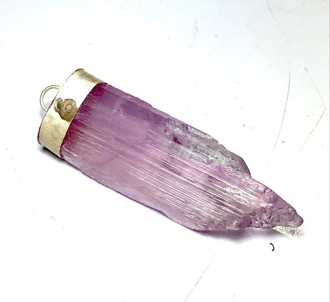 Pink Kunzite Crystal Necklace in Silver: Pink Kunzite Crystal Necklace in Silver Shipping: $23.00. Shipping rates are determined by Parcel weight and destination.