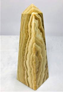 Layered Choclate Calcite point tower - 644.2G: Layered Choclate Calcite point tower - 155X51mm - 644.2G Shipping: $60.00. Shipping rates are determined by Parcel weight and destination.