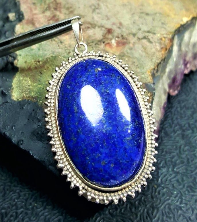 Blue Lapis Pendant: Blue Lapis Minimalist Pendant - 51X34X9 mmShipping Rate: $23.00 .shipping rates are determined by Parcel weight and destination.Combined shipping: We offer combine shipping on multiple items purchased