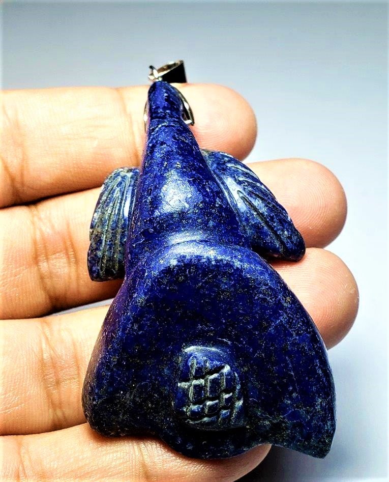 Lapis Lazuli Flower Pendant: Lapis Lazuli Flower Pendant - 63X36X18 mm Shipping: $23.00. Shipping rates are determined by Parcel weight and destination.