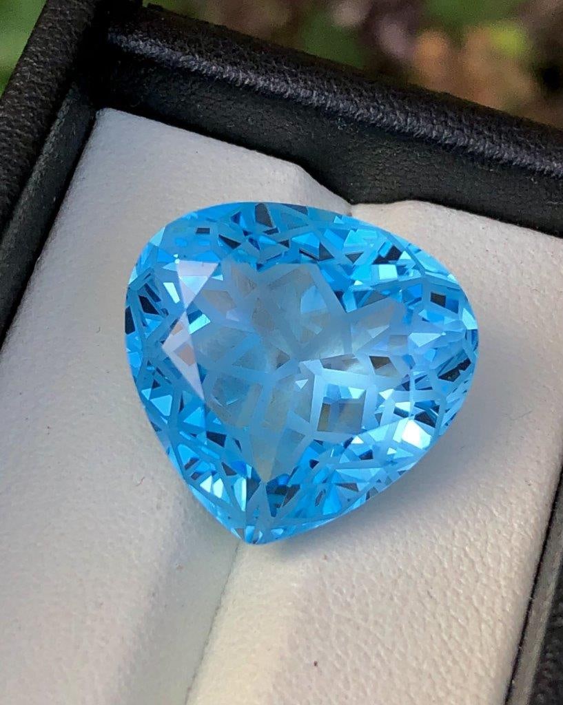 Top Quality Flower Cut Swiss Blue Topaz - 28.35 Carats - 20X19X11 mm: Top Quality Flower Cut Swiss Blue Topaz - 28.35 Carats - 20X19X11 mm Shipping Rate: $15.00 .shipping rates are determined by Parcel weight and destination.Combined shipping: We offer combine shipping