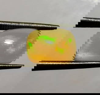 Fire Ethopian Opal - 1.5 Carats: Fire Ethopian Opal - 1.5 Carats - 10X8X5 mmShipping Rate: $15.00 .shipping rates are determined by Parcel weight and destination.Combined shipping: We offer combine shipping on multiple items purchase