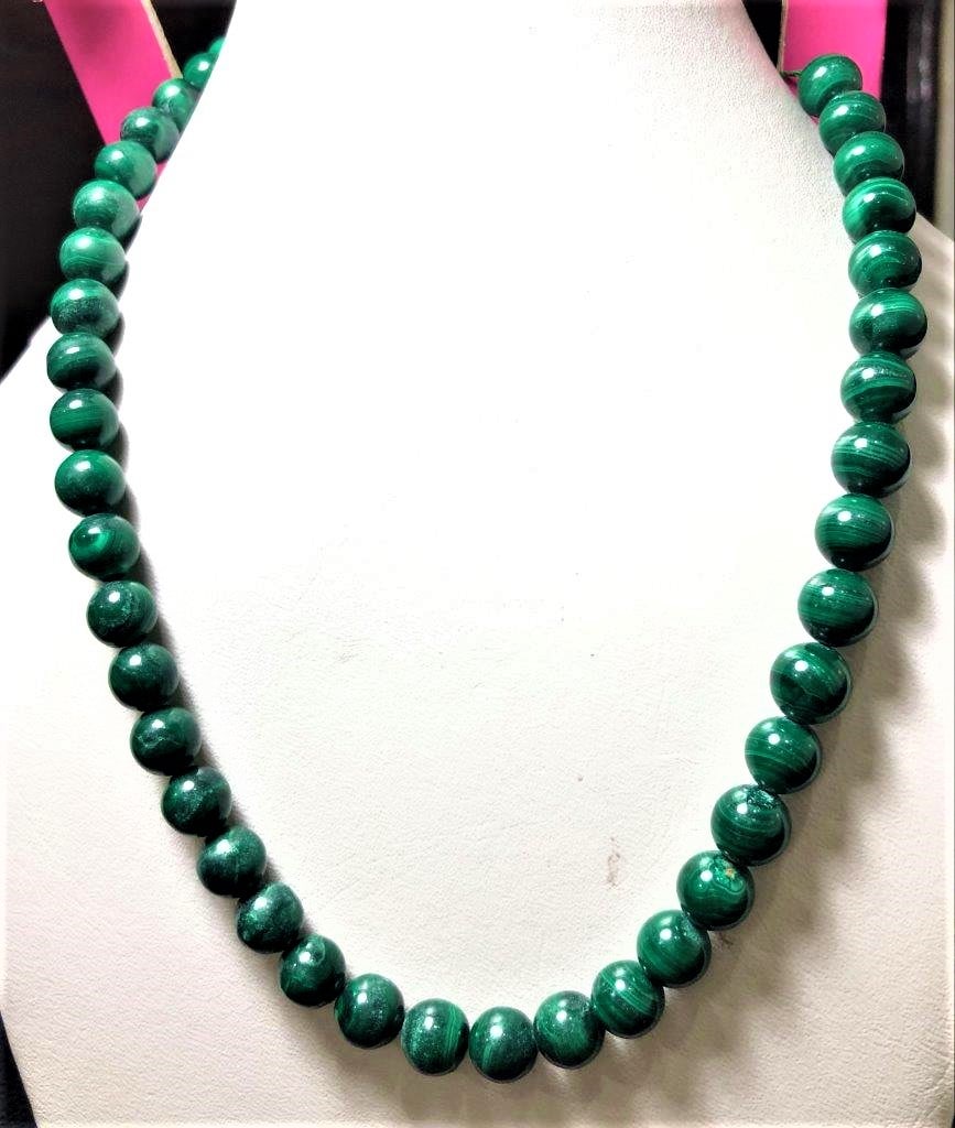Malachite Necklace - 10 mm Beads: Malachite Necklace - 10 mm BeadsShipping Rate: $23.00 .shipping rates are determined by Parcel weight and destination.Combined shipping: We offer combine shipping on multiple items purchased to reduce