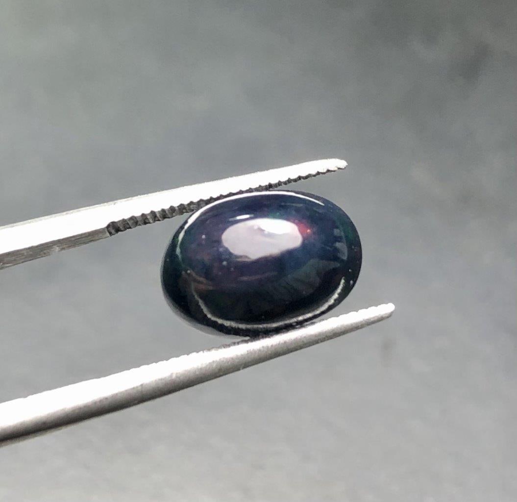 1.85 Carats Natural Black Opal - 10X7X6 mm: 1.85 Carats Natural Black Opal - 10X7X6 mm Shipping: