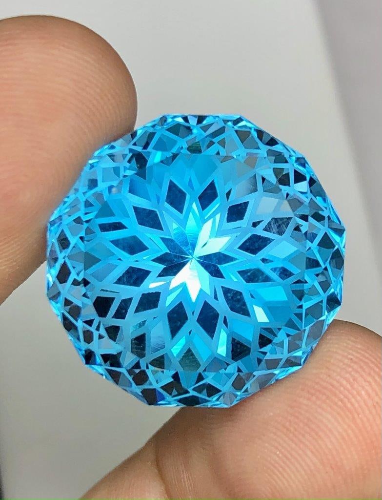 52.25 Carats Swiss Blue Topaz Perfect Flower Cut Gemstone - 22X22X15.5 mm: 52.25 Carats Swiss Blue Topaz Perfect Flower Cut Gemstone - 22X22X15.5 mmShipping Rate: $15.00 .shipping rates are determined by Parcel weight and destination.Combined shipping: We offer combine shipp