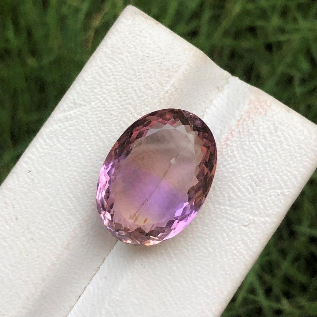 Natural Ametrine with Oval Cutting -20.55 Carats: Natural Ametrine with Oval Cutting -20.55 Carats - 21X15X10 mmShipping Rate: $15.00 .shipping rates are determined by Parcel weight and destination.Combined shipping: We offer combine shipping on