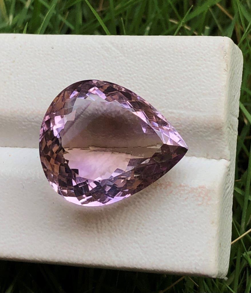19.85 Carats Ametrine: 19.85 Carats Ametrine - 20X16X10 mmShipping Rate: $15.00 .shipping rates are determined by Parcel weight and destination.Combined shipping: We offer combine shipping on multiple items purchased to red