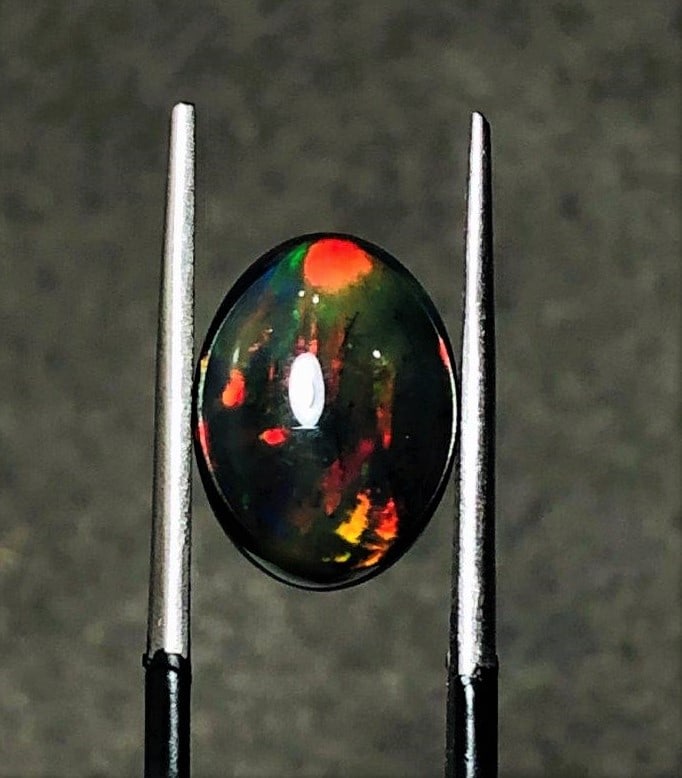 2crts Ethopian Black Fire Opal: 2crts Ethopian Black Fire Opal - 11X9X5 mmShipping Rate: $15.00 .shipping rates are determined by Parcel weight and destination.Combined shipping: We offer combine shipping on multiple items purchased