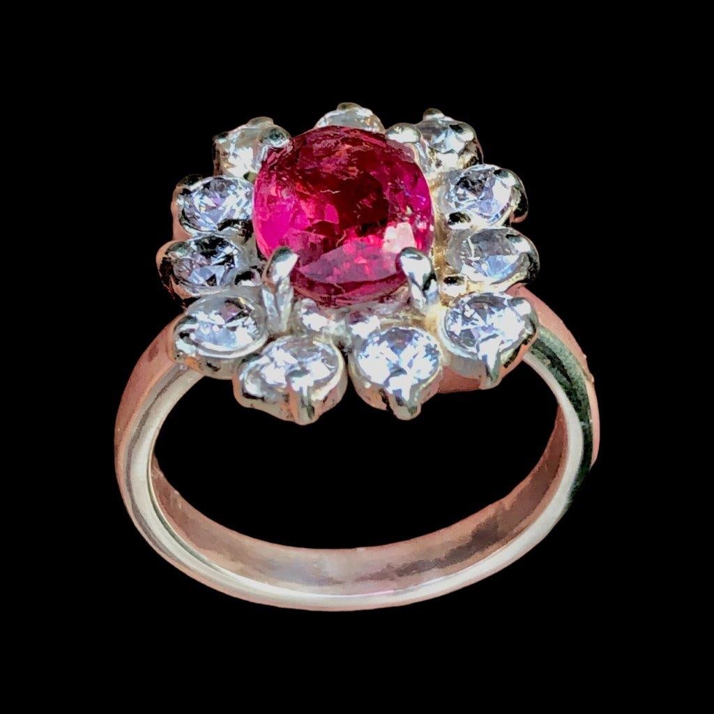 Rubelite Tourmaline Ring in Silver With Zircons: Rubelite Tourmaline Ring in Silver With Zircons Stone Weight: 3 CaratsRing Size: 9 US(Adjustable)Ring Weight: 5 GramsMetal: Silver Choose design of your own and we will make it for youWe accept custom