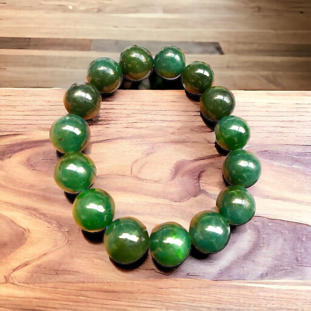Deep Green Nephrite Jade Stretchable Bracelet 15 mm: Deep Green Nephrite Jade Stretchable Bracelet 15 mmShipping Rate: $25.00 .shipping rates are determined by Parcel weight and destination.Combined shipping: We offer combine shipping on multiple items