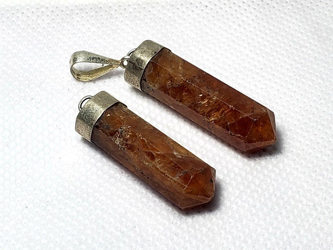 Sterling Silver Hessonite Garnet Pendants: Sterling Silver Hessonite Garnet Pendants Shipping: $23.00. Shipping rates are determined by Parcel weight and destination.