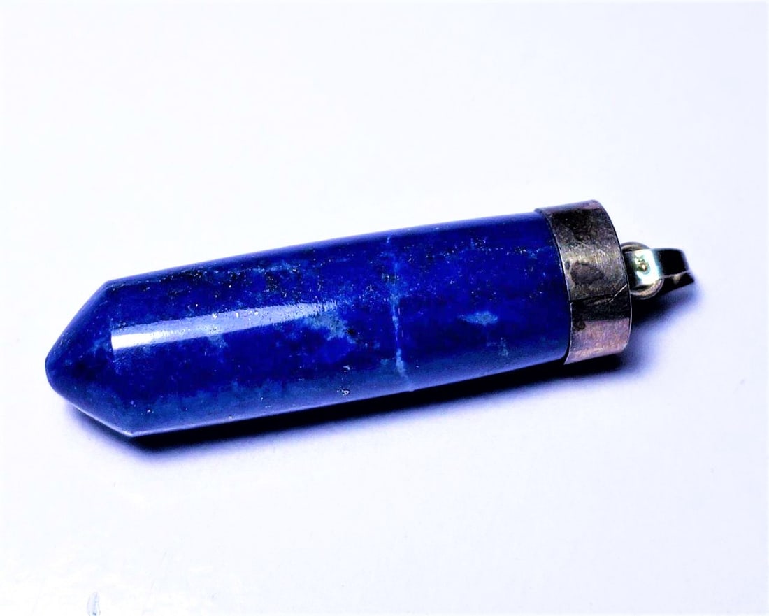 Lapis Lazuli Pendant: Lapis Lazuli Pendant - 35X11X10 mm Shipping: $23.00. Shipping rates are determined by Parcel weight and destination.