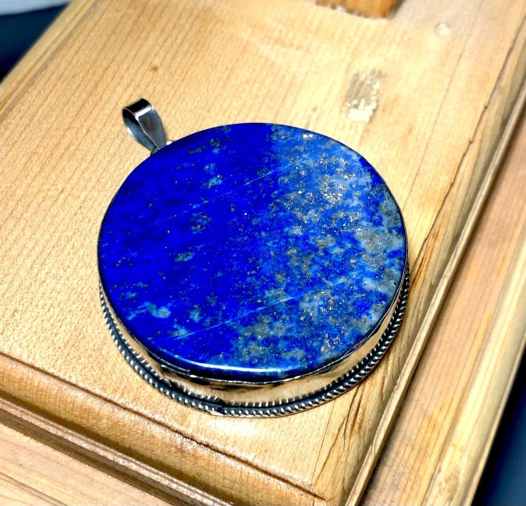 Madani Lapis Afghanistan - Elegant, Minimalist Pendant: Madani Lapis Afghanistan - Elegant, Minimalist Pendant Shipping: $23.00. Shipping rates are determined by Parcel weight and destination.