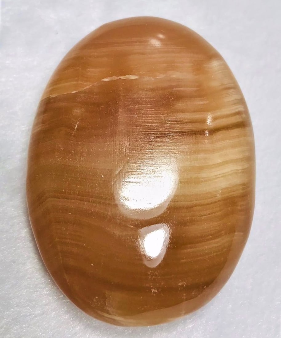 Honey Calcite oval shape stone 122.6G (1 of 2)