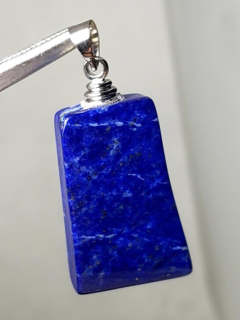 Sterling Silver Royal Blue Lapis Lazuli Pendant: Sterling Silver Royal Blue Lapis Lazuli Pendant - 37X19X9 mm Shipping: $23.00. Shipping rates are determined by Parcel weight and destination.