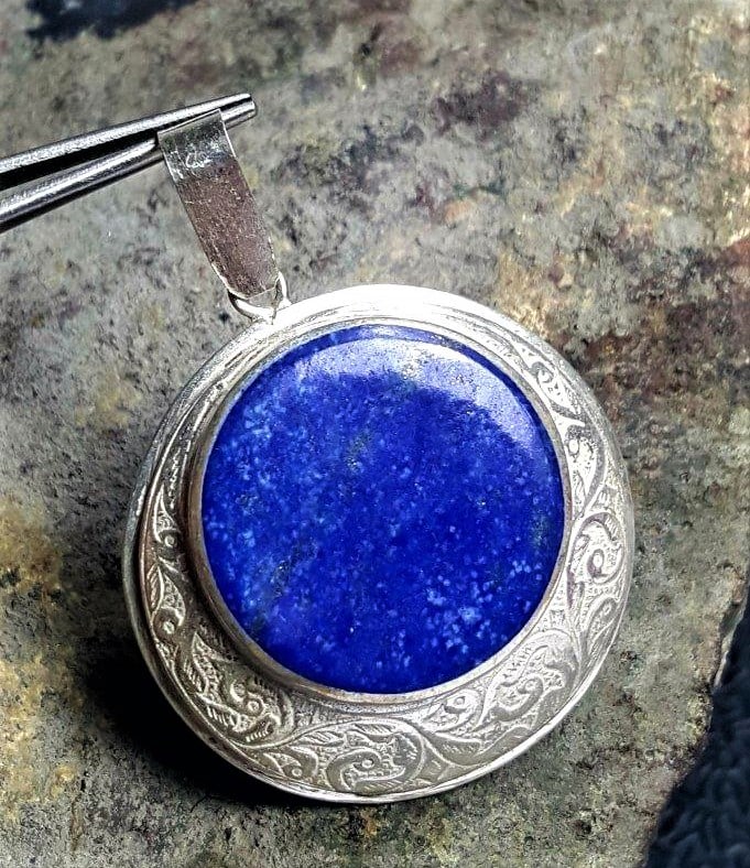 Sterling Silver Lapis Pendant: Sterling Silver Lapis Pendant - 36X33X9 mmShipping Rate: $23.00 .shipping rates are determined by Parcel weight and destination.Combined shipping: We offer combine shipping on multiple items purchased