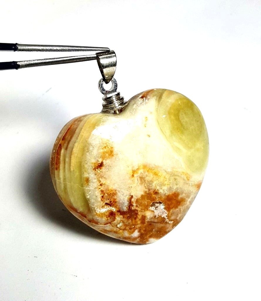 Sterling Silver Onix Heart Pendant: Sterling Silver Onix Heart Pendant - 40X38X13 mm Shipping: $23.00. Shipping rates are determined by Parcel weight and destination.